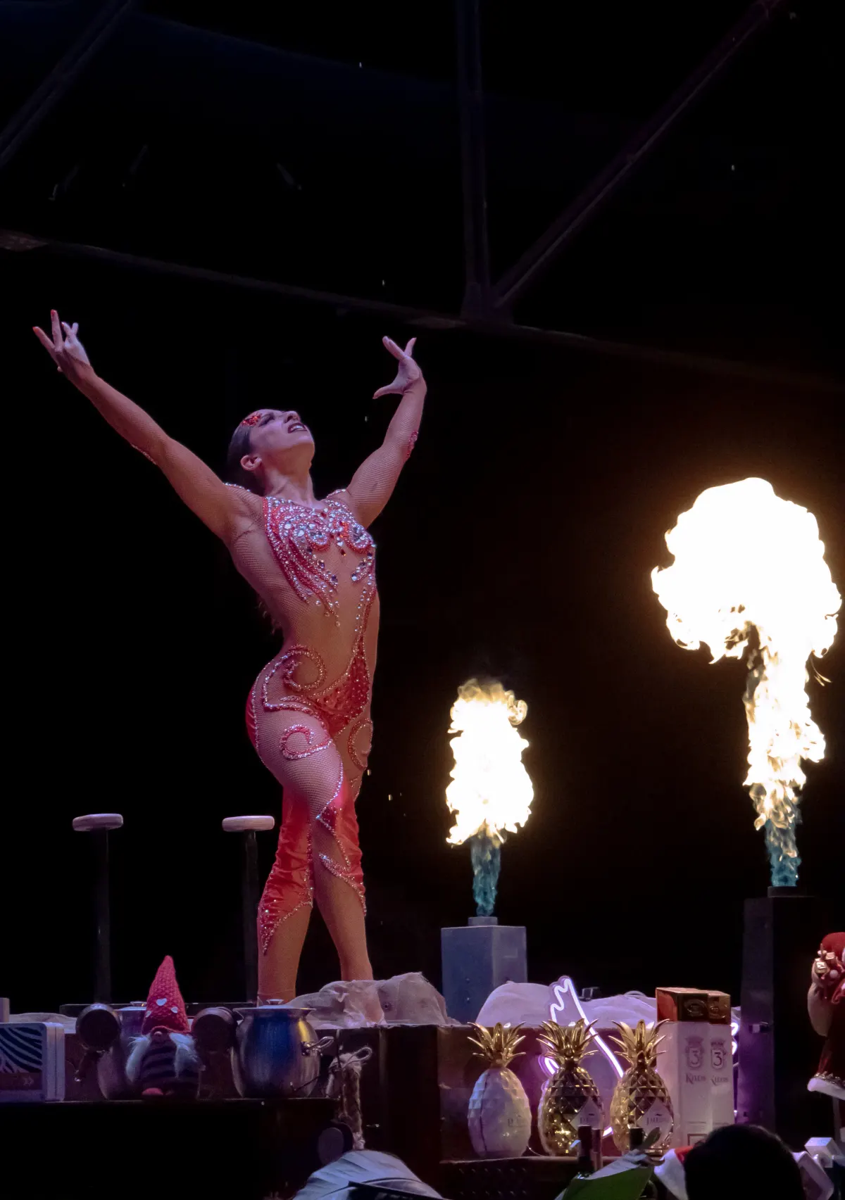 Sara Brigite on aerial straps, silhouette under purple light
